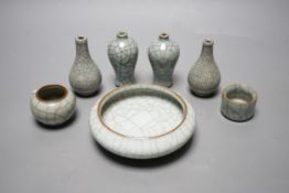 Seven Chinese Guan-type crackle glaze vessels one with four character mark, largest 11cm diameter