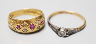 An Edwardian 18ct gold and gypsy set ruby and diamond chip set ring, size J/K and an 18ct and