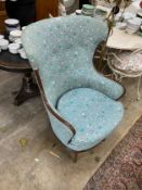 An early 20th century American mahogany upholstered armchair on spiral carved feet, width 79cm,
