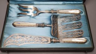 A cased ornate French white metal and mother of pearl mounted serving set, comprising a pair of fish