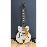 A Gretsch Bigsby electromatic guitar with case