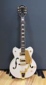 A Gretsch Bigsby electromatic guitar with case