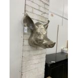 A cast metal wall mounted pigs head ornament, height 44cm
