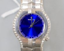 A lady's stylish modern steel Tag Heuer quartz wrist watch and bracelet, with blue dial and
