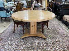 A Regency style circular pine tilt top breakfast table, diameter 120cm, height 73cm