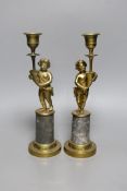 A pair of early 20th century gilt brass figural candlesticks, 27.5cm