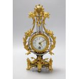 An early 20th century French ormolu mounted miniature lyre clock, 24 cm time