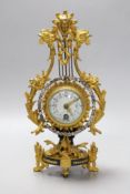 An early 20th century French ormolu mounted miniature lyre clock, 24 cm time