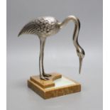 An Art Deco silvered bronze model of a crane, on an onyx base, 18cm
