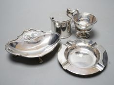 A late Victorian silver mustard pot, Sheffield, 1896, a later silver ashtray and small bowl and an