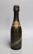 A half bottle of Ernest Irroy champagne with a Union Jack flag