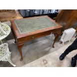 A reproduction Victorian style two drawer writing table, width 110cm, depth 70cm, height 77cm