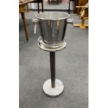 An Alessi wine cooler and stand height 82cm.