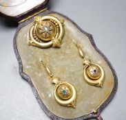 A cased Victorian yellow metal and emerald? set demi parure, comprising a brooch and pair of drop
