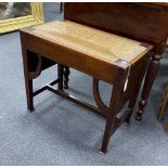 An Arts & Crafts mahogany stool with drop in rush seat, width 61cm, depth 34cm, height 53cm.