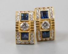 A modern pair of yellow metal, sapphire and diamond cluster set curved rectangular earrings, 14mm,