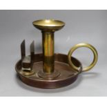 A large brass and copper chamberstick by G Farris, London, 20cm