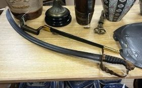 A reproduction cavalry sabre and a bayonet fixing