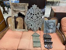 A carved Eastern hardwood window frame, height 82cm, a composition lion mask wall fountain two spoon