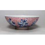 A Chinese underglaze blue and puce enamelled 'eight immortals' bowl, 22cm diameter