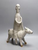 An abstract studio pottery figure of man on a donkey. 43cm high