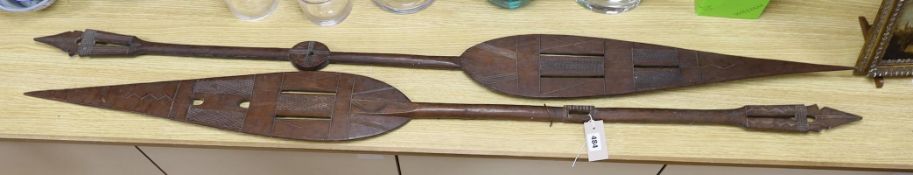 A pair of carved wood paddles, possibly Polynesian. 155cm long