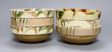 Six French slipware bowls, 16.5cm diameter