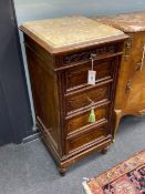 A pair of early 20th century French rosewood five drawer marble top bedside cabinets, width 39cm,
