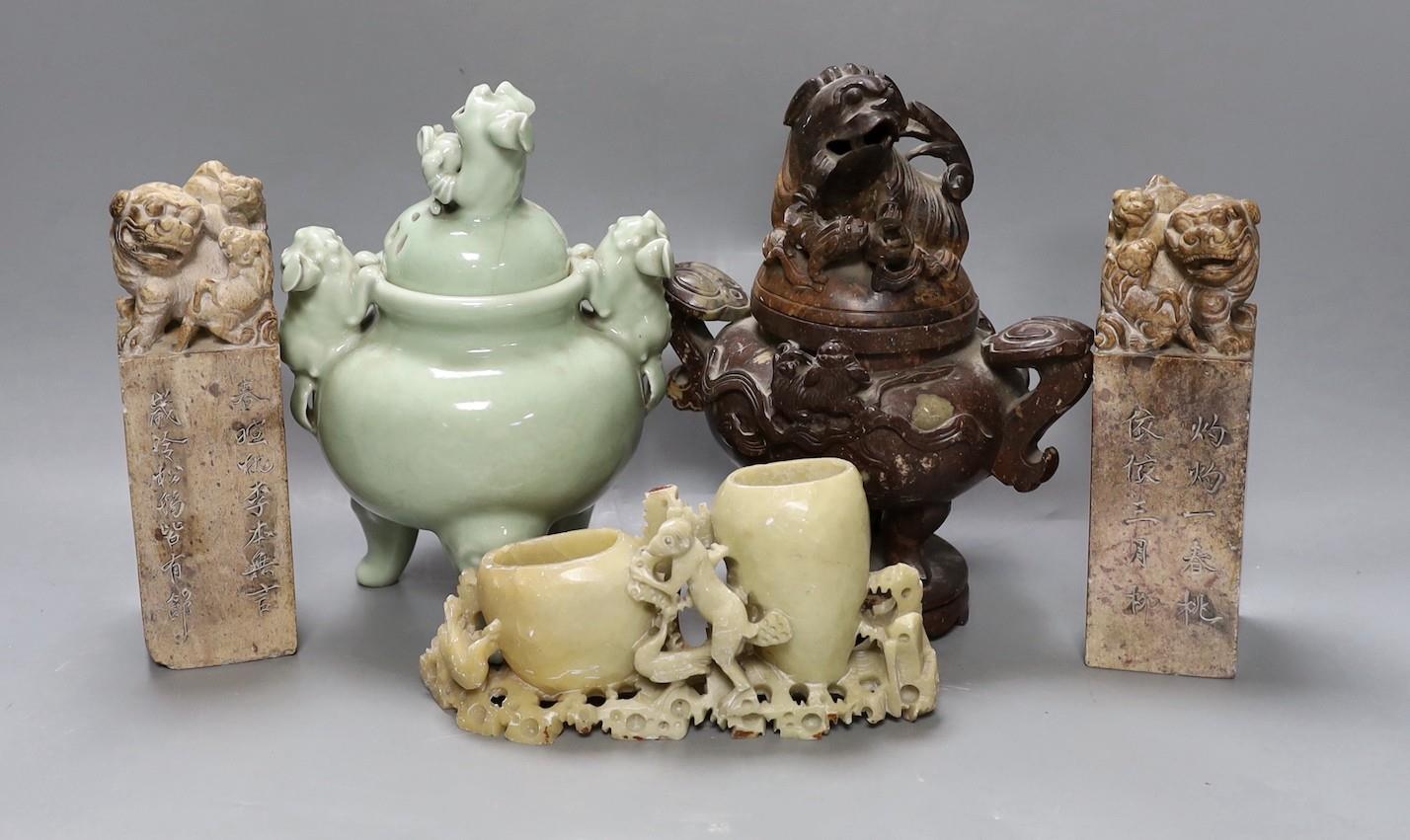 A Chinese celadon ground censer, together with a hardstone censer, a soapstone carving and two