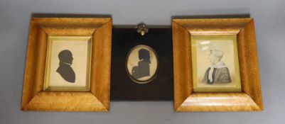 A pair of maple framed 'husband and wife' miniatures together with another silhouette