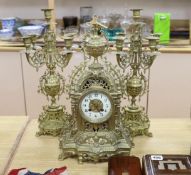 A French brass clock garniture c.1900, Japy Freres movement. 48cm high