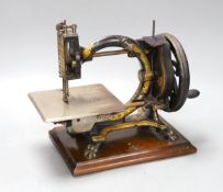 A Smith & Co. The Monarch sewing machine with original case and manual