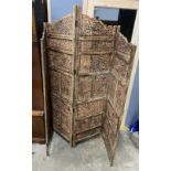 An Indian carved hardwood four fold screen, largest panel width 50cm, height 184cm