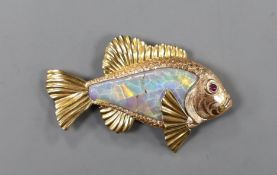 A yellow metal mounted white opal set brooch, modelled as a fish, with cabochon set eye, 60mm, gross