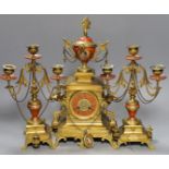 A late 19th century French Etruscan revival ormolu and porcelain mounted three piece clock