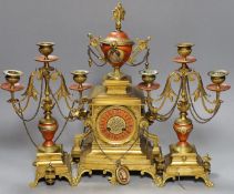 A late 19th century French Etruscan revival ormolu and porcelain mounted three piece clock