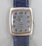 A gentleman's 1970's silver Rotary manual wind wrist watch, with Arabic dial, on associated