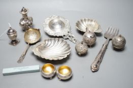 Small silver including two butter shells, a continental silver tea strainer, English tea strainer,