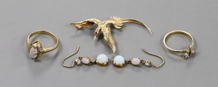 A 14k and gem set 'bird in flight' brooch, 50mm, gross weight 4.1 grams, a 9k and white opal ring,