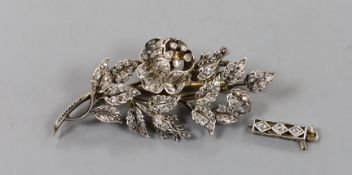 A late 19th/early 20th century yellow metal diamond chip set set floral spray brooch, 52mm, gross