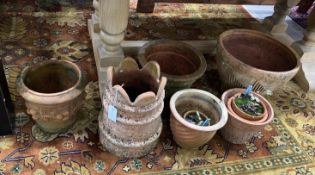 Nine terracotta planters, largest diameter 40cm, height 39cm