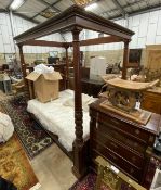 A reproduction carved mahogany four poster double bed frame with Visprung Lynton mattress, width