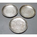 Three Chinese white metal dishes, each inset with coin, maker HC, 94mm, 196 grams gross.