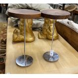 A pair of contemporary hardwood topped steel stands