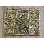 Three Chinese carved giltwood ‘warriors’ panels, largest 48 cm X 25 cm