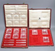 In incomplete set of Baccarat butter dishes together with a complete set of Baccarat butter dishes