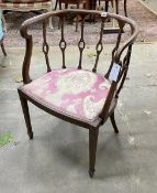 An Edwardian inlaid mahogany tub chair