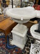 A cast resin faux marble garden urn on square stand, diameter 75cm, height 120cm