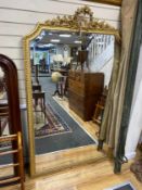 A late 19th century French Louis XVI style giltwood and composition overmantel mirror with floral