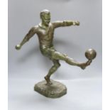 H. Fugere. A large patinated spelter figure of a football player, 50cm tall